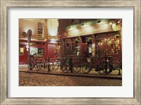 Framed Bicycles parked in front of a restaurant at night, Dublin, Ireland