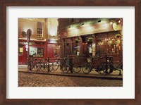 Framed Bicycles parked in front of a restaurant at night, Dublin, Ireland