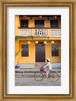 Framed Person riding a bicycle in front of a cafe, Hoi An, Vietnam