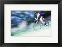 Framed Side profile of a young man riding a bicycle