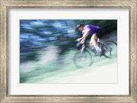 Framed Side profile of a young man riding a bicycle