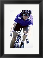 Framed Young woman riding a bicycle