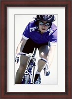 Framed Young woman riding a bicycle
