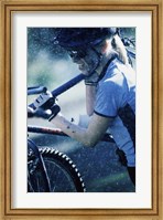 Framed Young woman carrying a bicycle on her shoulders