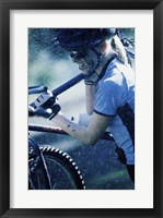 Framed Young woman carrying a bicycle on her shoulders