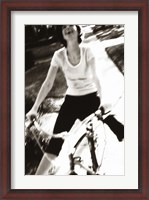 Framed Young woman riding a bicycle - black & white