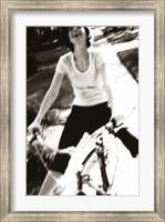 Framed Young woman riding a bicycle - black & white