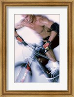 Framed Close-up of a young man riding a bicycle