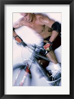 Framed Close-up of a young man riding a bicycle