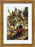 Framed Young man falling off his bicycle in a race