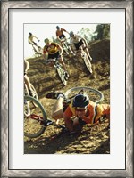 Framed Young man falling off his bicycle in a race