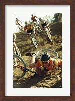 Framed Young man falling off his bicycle in a race