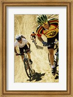 Framed Group of people riding bicycles in a race