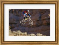 Framed Side profile of a person on a bicycle in mid air