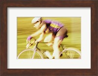 Framed Side profile of a young man cycling