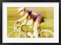 Framed Side profile of a young man cycling