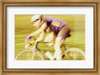 Framed Side profile of a young man cycling