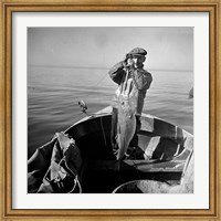 Framed Hauling in a cod aboard a Portuguese fishing dory off Cape Cod, Massachusetts