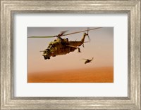Framed Afghan Air Corps Mi-35 helicopters