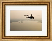 Framed Air Force helicopter flys over Lake Pontchatrain to New Orleans