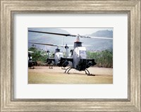 Framed Three AH-1 Cobra gunship helicopters