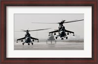 Framed MI-35 attack helicopters from the Afghan National Army Air Corps