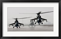 Framed MI-35 attack helicopters from the Afghan National Army Air Corps