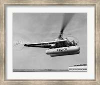 Framed Low angle view of a helicopter in flight, Bell 47-D, Bell Aircraft Corporation