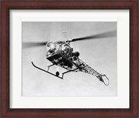 Framed Low angle view of military helicopter in flight