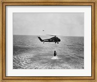 Framed Marine helicopter lifting the astronaut spacecraft out of the Ocean