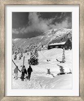 Framed USA, Washington state, three people carrying their skis