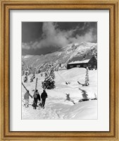 Framed USA, Washington state, three people carrying their skis