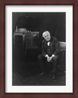 Framed Thomas Edison, seated beside phonograph