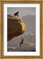 Framed View of rock climbers on the edge of a cliff