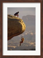 Framed View of rock climbers on the edge of a cliff