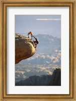 Framed Two hikers with ropes at the edge of a cliff 2