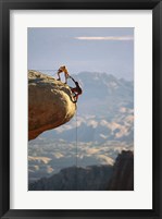 Framed Two hikers with ropes at the edge of a cliff 2