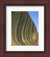 Framed Person climbing Wave Rock, Western Australia, Australia