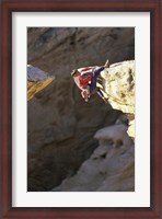 Framed High Angle View of a Man hanging off of a Summit