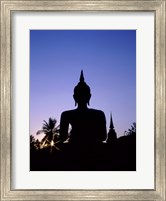 Framed Silhouette of Buddha and temple during sunset, Sukhothai, Thailand