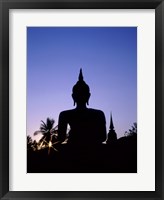 Framed Silhouette of Buddha and temple during sunset, Sukhothai, Thailand