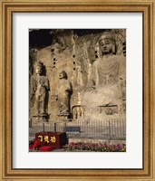 Framed Buddha Statue in a Cave, Longmen Caves, Luoyang, China with Flowers