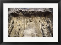 Buddha Statue Carved on a wall, Longmen Caves,  ground view in China Framed Print