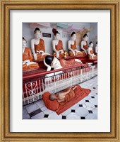 Framed Monk Sleeping in Front of Buddha Statues