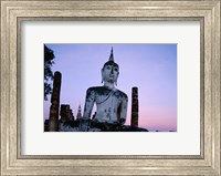 Framed Low angle view of the Seated Buddha, Wat Mahathat, Sukhothai, Thailand