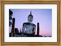 Framed Low angle view of the Seated Buddha, Wat Mahathat, Sukhothai, Thailand