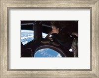 Framed Tracy Caldwell Dyson in the Cupola Observing the Earth during Expedition 24