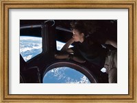 Framed Tracy Caldwell Dyson in the Cupola Observing the Earth during Expedition 24