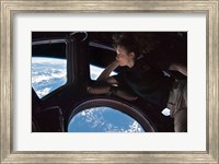 Framed Tracy Caldwell Dyson in the Cupola Observing the Earth during Expedition 24