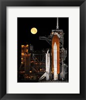 Framed Space Shuttle Discovery under a Full Moon